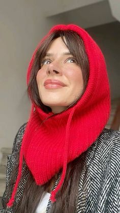 a woman wearing a red scarf around her neck