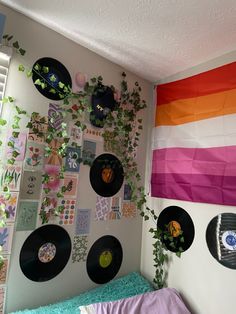 a room with various records and plants on the wall