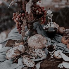 a table topped with bread and other food