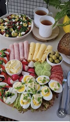 an assortment of food is displayed on a table