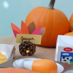 a table topped with pumpkins and other items