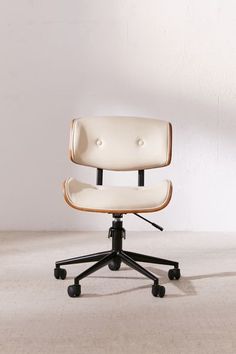 an office chair sitting on top of a white floor