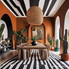 an orange and black dining room with potted cacti