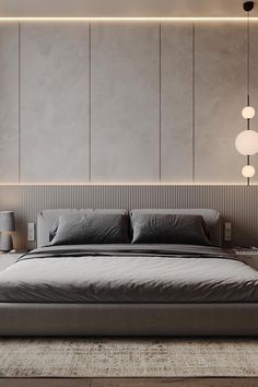 a modern bedroom with grey walls and bed