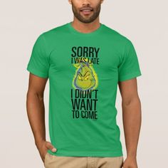 a man wearing a green t - shirt that says sorry i was late, i don't want to come