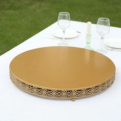 a gold plate sitting on top of a white table