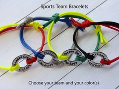 four bracelets with the words sports team bracelets choose your team and your colors