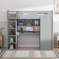 there is a loft bed with desk and shelves in the room that has a rug on the floor