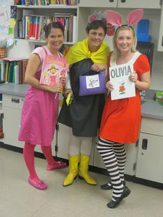 three girls dressed up in costumes posing for the camera