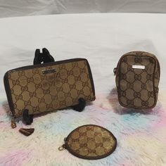 This Is A Vintage Bundle Of A Gucci Canvas Long Wallet, A Small Gucci Coin Bag And A Gucci Mini Pouch! All Are Authentic And Vintage And Shows Signs Of Use. The Wallet Has The Zipper Pull Piece Loose But Is Still Available, Has Corner Wear, The Coin Bag Has Zipper Pull Missing And Show A Lot Of Signs Of Aging. The Small Gucci Pouch Shows Rubbing On Piping, No Exposed Piping. Otherwise Please See Pictures Of All Signs Of Use. All Items In This Bundle Are Authentic. Long Wallet: Zipper Works Great Gucci Pouch, Gucci Mini, Gucci Vintage, Mini Pouch, Bag Gucci, Mini Pouches, Coin Bag, Brown Silver, Coin Pouch