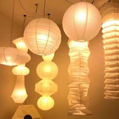 several white paper lanterns hanging from the ceiling