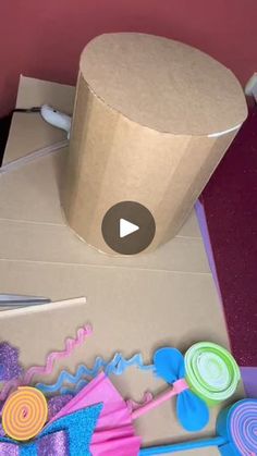 a cardboard box with some candy on it and a paper cup in the top right corner