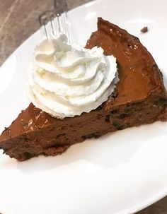 a piece of chocolate pie with whipped cream on top