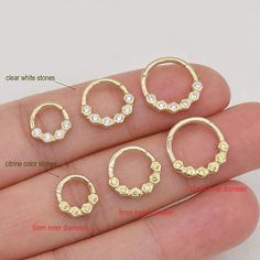 Metal: 14k solid gold, Available Gold color: Yellow gold Guaranteed Authentic 14k Gold, Not Plated or Filled Stone: Round CZ (white color cz and citrine color cz) Thickness: 1.2mm(16G) Inner diameter:6mm&8mm&10mm Stamp:14k  Sale as Single piece  SHIPPING ADDRESS ●All the orders will ship to the supplied address through your Etsy Order, Please leave your phone number,will give to carrier for safe deliver. ●We will not send and replacement parcels due to incomplete or inaccurate address.  PACKING ●Can be Gift packed including Jewelry Box, Ribbon or Bow and your personlized message.  RETURN/REFUND ● We gladly accept refunds on undamaged goods up to 7 days after delivery in the original packaging. ● Please contact me for asking the return address.  CUSTOMS & DUTY ●Buyer/Customers are responsib Gold Cubic Zirconia Hoop Septum Ring, Gold Hoop Septum Ring With Prong Setting, Gold Hoop Piercings With Prong Setting, Gold Cubic Zirconia Huggie Ring, Silver Hoop Septum Ring In 14k Gold, Silver 14k Gold Hoop Septum Ring, 14k Gold Hoop Septum Ring, 14k Gold Hoop Piercings For Gift, Gold Small Hoop Ring With Prong Setting