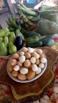 there are many different types of vegetables on the table together, including eggplant and zucchini