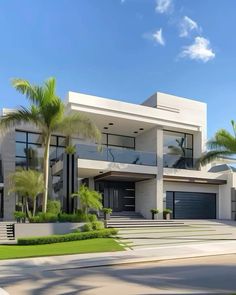 a large white house with palm trees in the front yard and stairs leading up to it