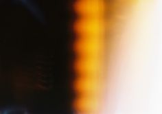 blurry photograph of an orange and yellow light