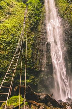 a ladder leading up to a waterfall