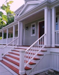 a house with red steps and white railings