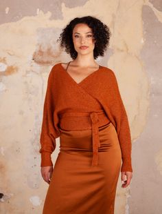 OVER THE SHOULDER V-NECK WRAP SWEATER W/ LONG DOLMAN SLEEVES IN RIB STITCH 6%WOOL 50%RECYCLED POLYESTER 29%NYLON 15%POLYESTER STYLE# G1146 Serena is 5'7" wearing a S/M Available in size: S/M, M/L Yarn Accessories, Rib Stitch, Outerwear Vest, Neck Wrap, Wrap Sweater, Sweater Sale, Dolman Sleeve, Signature Style, Clothes For Sale