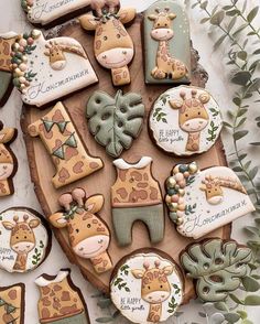 decorated cookies in the shape of giraffes on a table