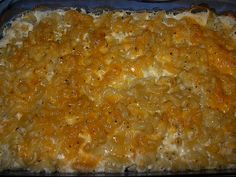 a casserole dish with cheese and onions in it, ready to be eaten