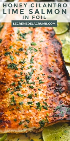 grilled salmon on a platter with limes and parsley in the background