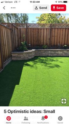 a backyard with artificial grass and wooden fence