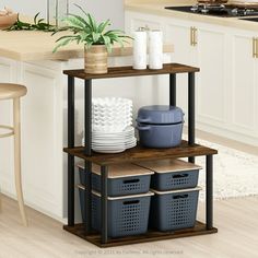 a kitchen island with three baskets on it and two plates stacked on top of each other