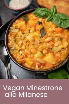 vegan minestone alla mianase in a bowl with basil leaves on top