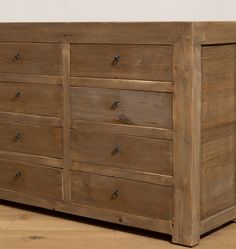 a large wooden dresser sitting on top of a hard wood floor