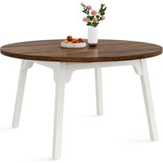 a white and brown table with flowers on the top is against a white background it has a bowl of fruit in front of it