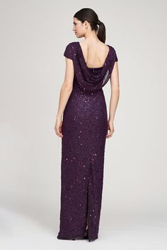 a woman in a long purple dress with sequins on the neck and back