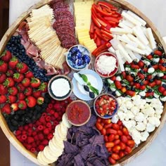 a platter filled with different types of fruits and vegetables