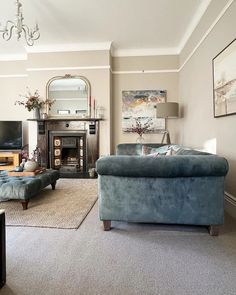 a living room filled with furniture and a fire place