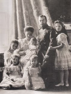 an old black and white photo of a family