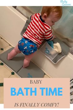 a baby is playing in the bath time