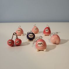 a group of small toy animals sitting next to each other on a white counter top