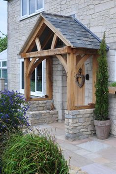 a small wooden building with a clock on it's side