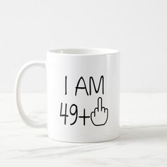 a white coffee mug with the words i am 94nd and two fingers pointing up