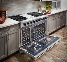 an oven with the door open and two burners on each side in a kitchen