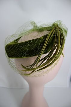 Vintage Green Hat For Wedding, Vintage Green Wedding Hat, Vintage Green Mini Hats For Spring, Formal Vintage Green Hat, Green Vintage Mini Hat With Short Brim, Vintage Green Mini Hat With Short Brim, Green Vintage Brimmed Mini Hat, Retro Adjustable Fascinator Hat, Vintage Green Brimmed Mini Hats