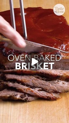 a person cutting meat with a knife on top of it that says oven baked brisket