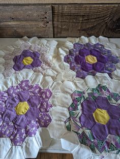 three quilts are laying on top of each other in the shape of hexagons