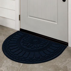 a blue door mat sitting on top of a white door