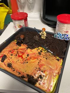 a birthday cake that has been made to look like it's melted orange and yellow