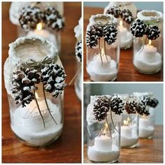 pine cones in mason jars filled with snow and lit candles are displayed on a table