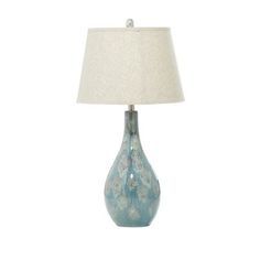 a blue lamp with a white shade on it