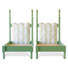 two green beds with matching headboards and foot boards on each side, one in the shape of a four post bed