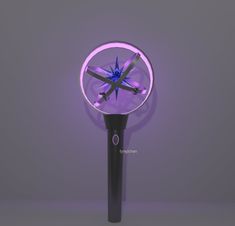 a close up of a purple light with a dragonfly on it's side